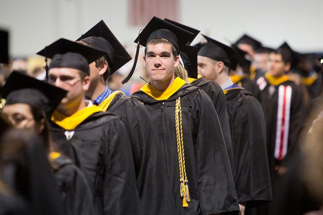 Students standing in line in their graduation gowns, ready for commencement 2012