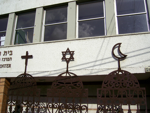 Three signs of religion, a cross, the star of David, and the crescent