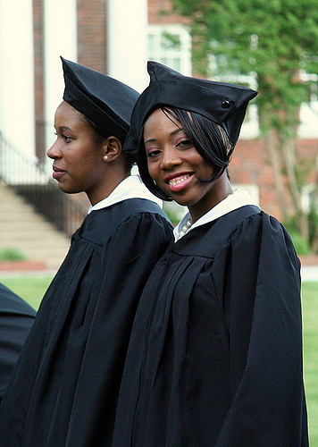 Two black female students in their graduation clothes