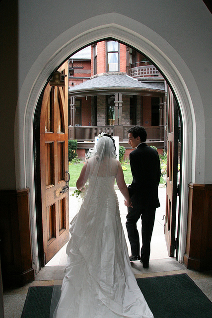 Husband and Wife exiting a church