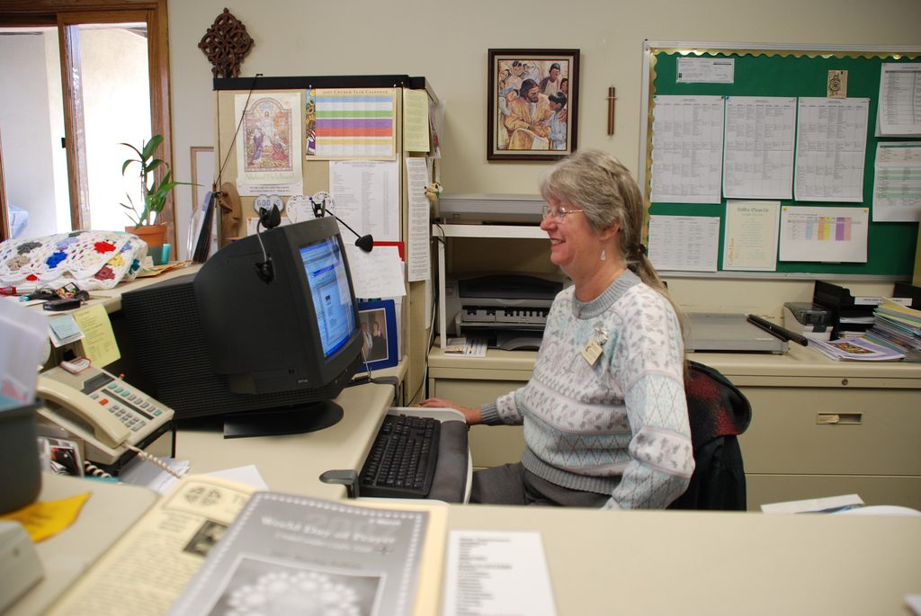 A woman at a desk, an employee of clerical work