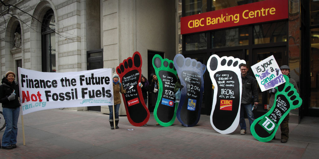 Protesters ralling against climate change in front of CIBC Banking Centre