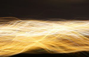 Image of yellow electrical wires/energy moving across the screen.